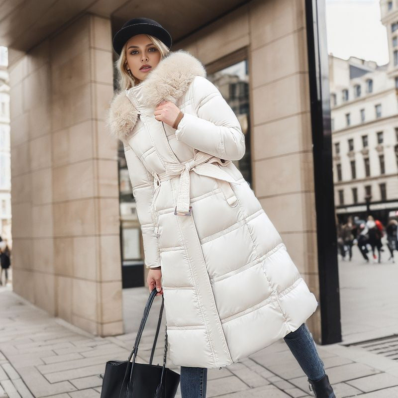 Sophisticated women's winter coat showcasing a stylish removable hood, offering both warmth and chic fashion.