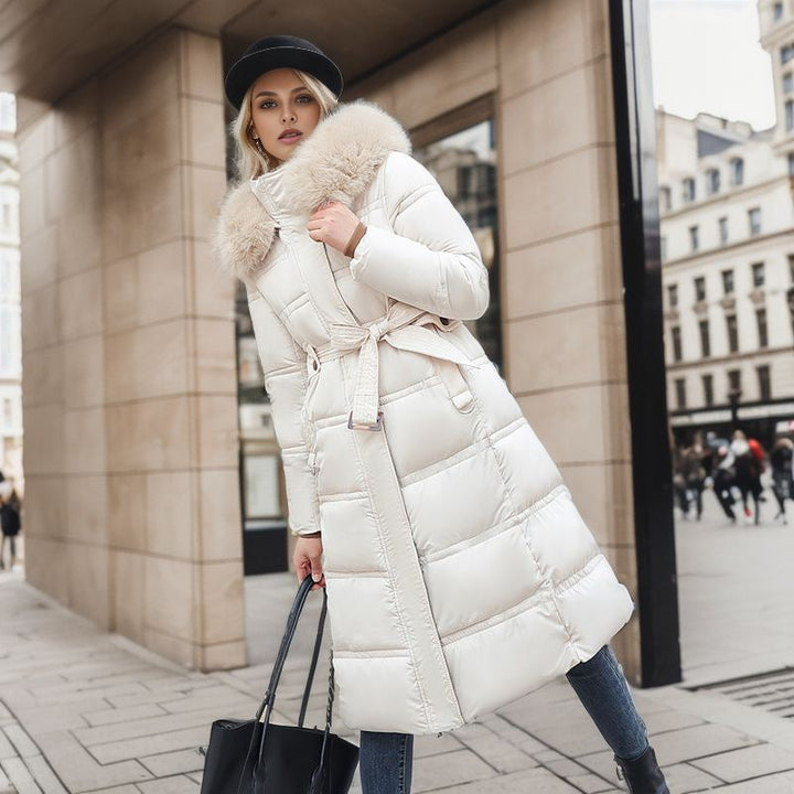 Sophisticated women's winter coat showcasing a stylish removable hood, offering both warmth and chic fashion.