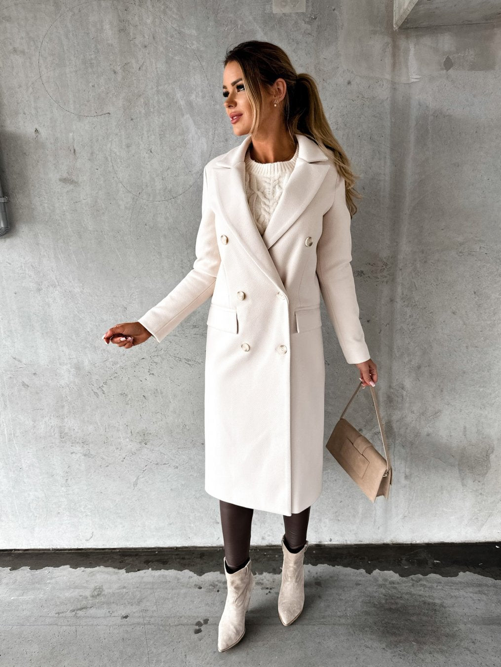 Stylish women's double-breasted winter coat. Elegant, warm outerwear for cold weather & versatile fashion.