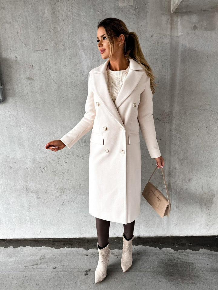 Stylish women's double-breasted winter coat. Elegant, warm outerwear for cold weather & versatile fashion.
