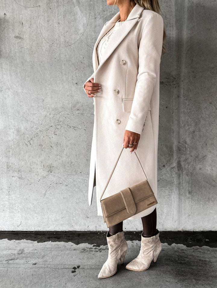 Warm & elegant women's winter coat, ideal for cold weather. Stylish double-breasted design, versatile fashion outerwear.