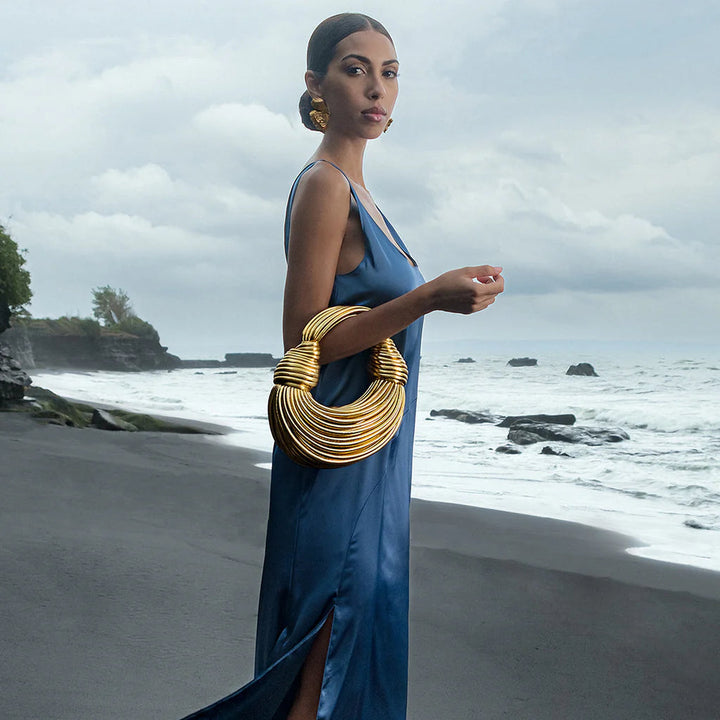 Elegant women's woven handbag with stylish knot detail, perfect for versatile fashion.