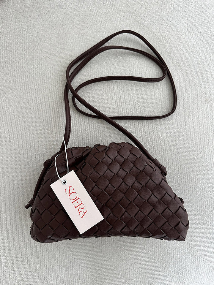 Modern women's woven shoulder bag, highly versatile for everyday use. Elegant, compact & stylish accessory.