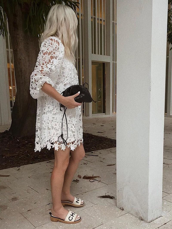 Women's woven shoulder bag complementing a chic outfit, perfect for everyday elegance. Modern & versatile.