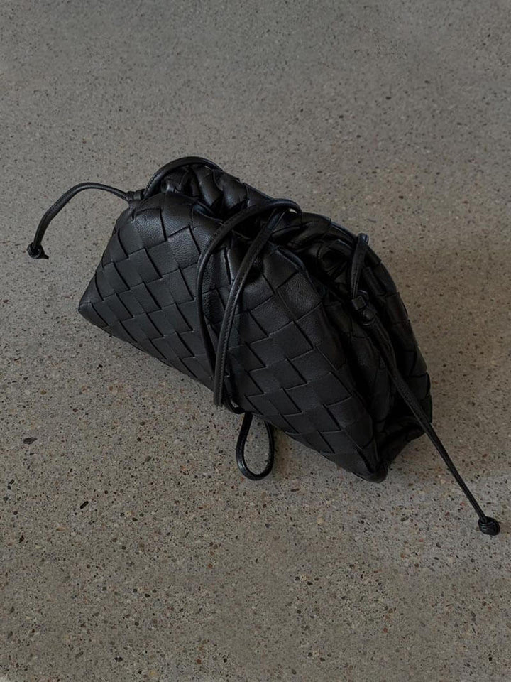 Full view of the elegant women's woven shoulder bag. A modern, compact & versatile everyday accessory.