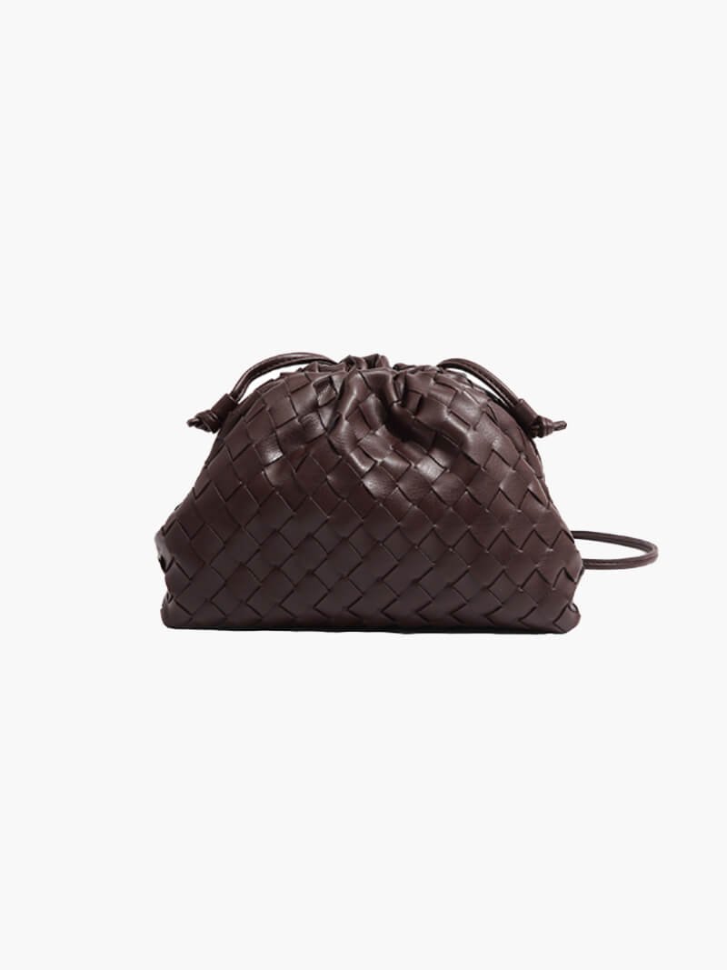Chic women's woven shoulder bag, showcasing its elegant design & durable construction. A modern everyday handbag.