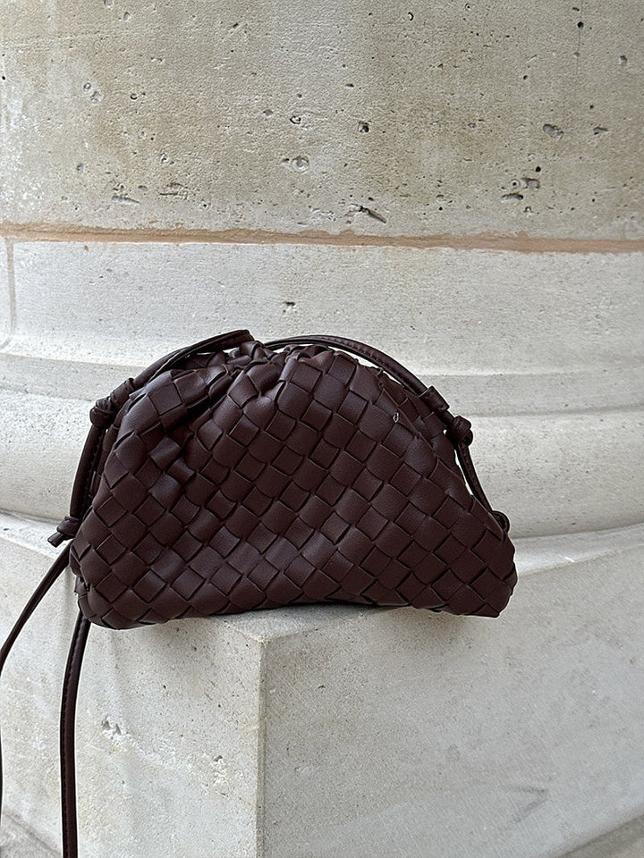 Interior of a compact women's woven shoulder bag, perfect for essentials. Minimalist & modern everyday handbag.