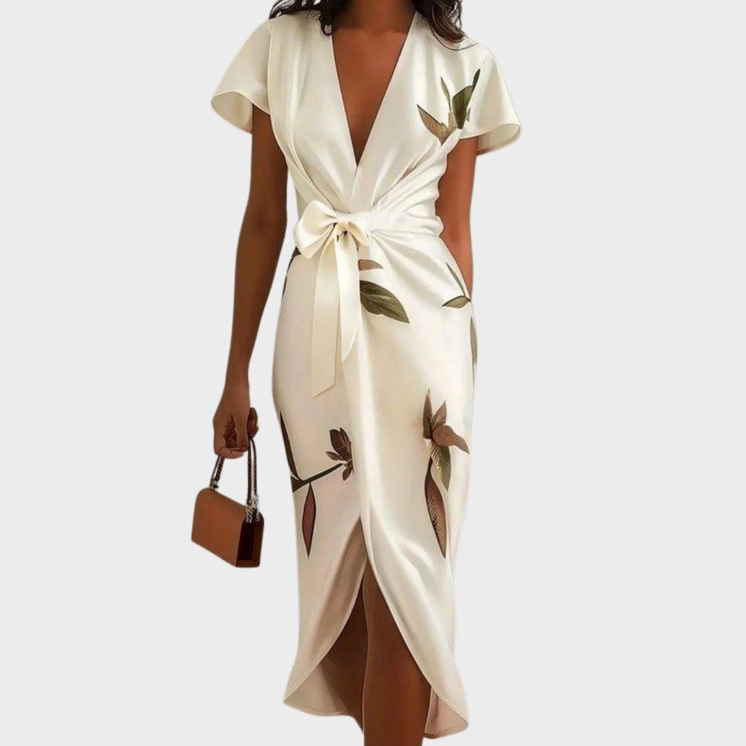 Elegant women's wrap maxi dress with flutter sleeves, a V-neck, and tie waist, perfect for spring fashion.