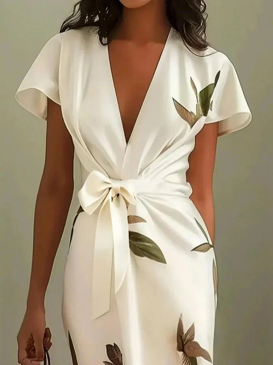 Women's elegant flutter sleeve wrap maxi dress in a floral print, comfortable V-neck design for summer occasions.