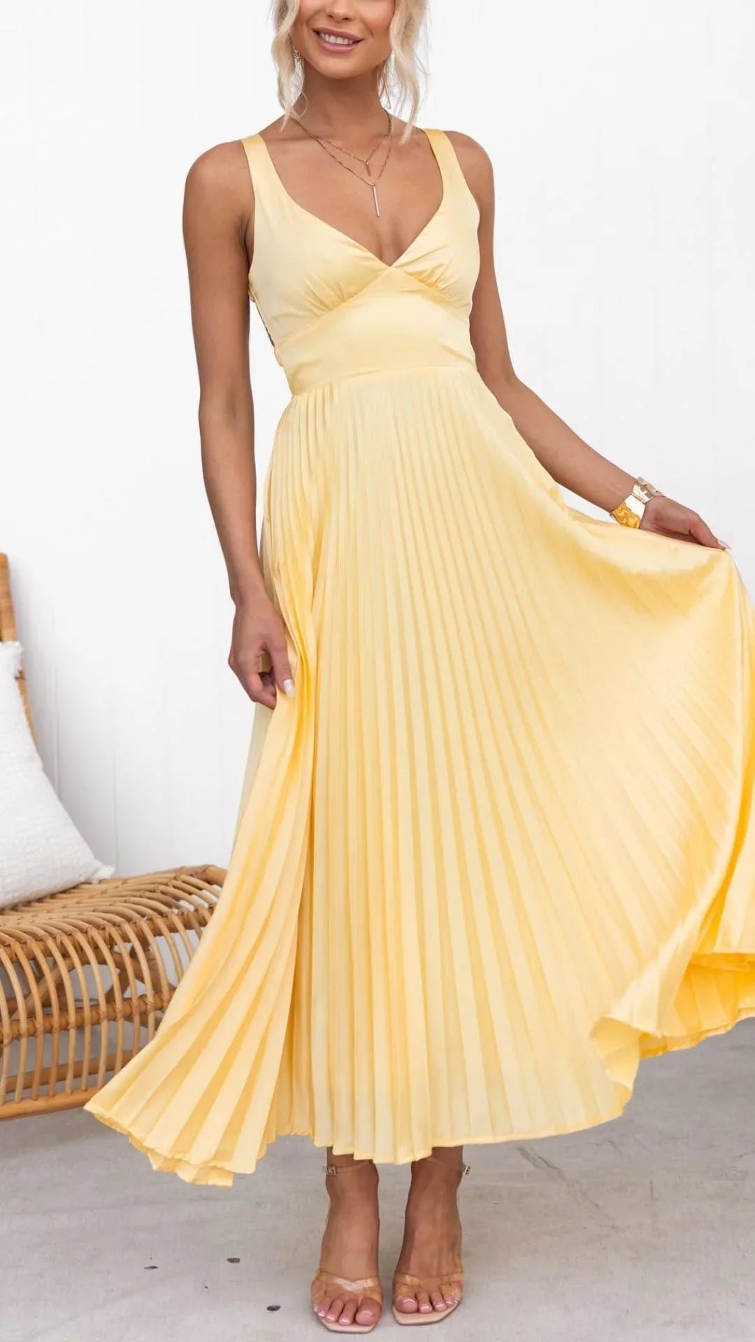 Elegant women's yellow pleated V-neck maxi dress, perfect for summer parties & formal occasions.