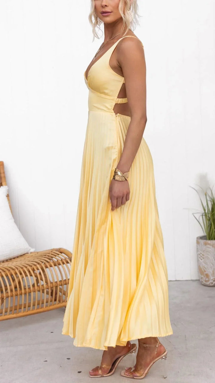 Sleeveless yellow pleated maxi dress with a flattering V-neck, a chic choice for elegant women's parties.