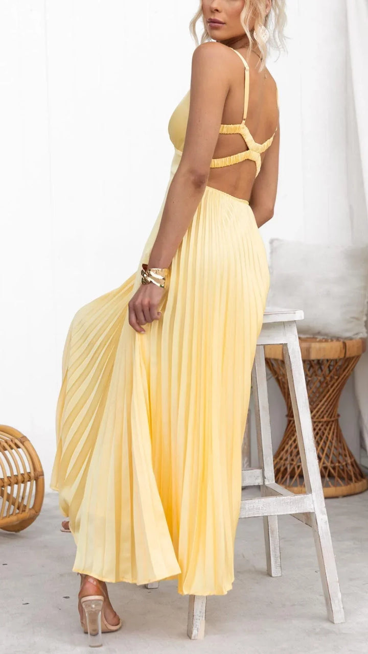 Stylish women's yellow maxi dress with V-neck and pleats, an elegant and versatile choice for occasions.