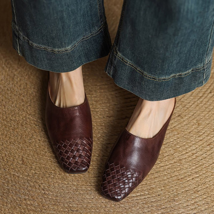 Elegant low-heel mules for women, a comfortable slip-on with a square toe and woven finish.