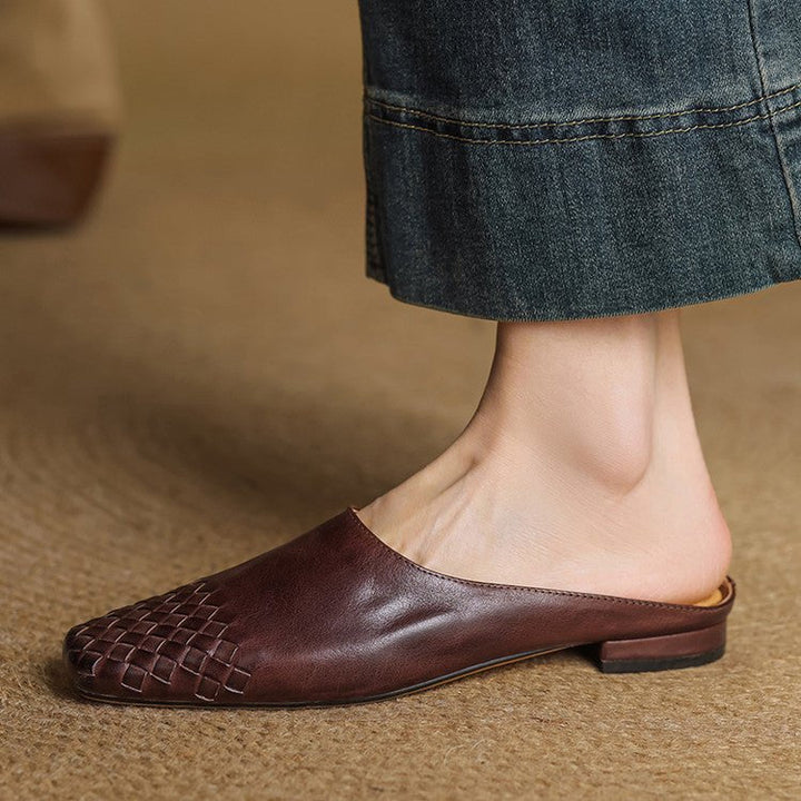 Women's square-toe slip-on mules, featuring a sophisticated woven pattern for a chic look.