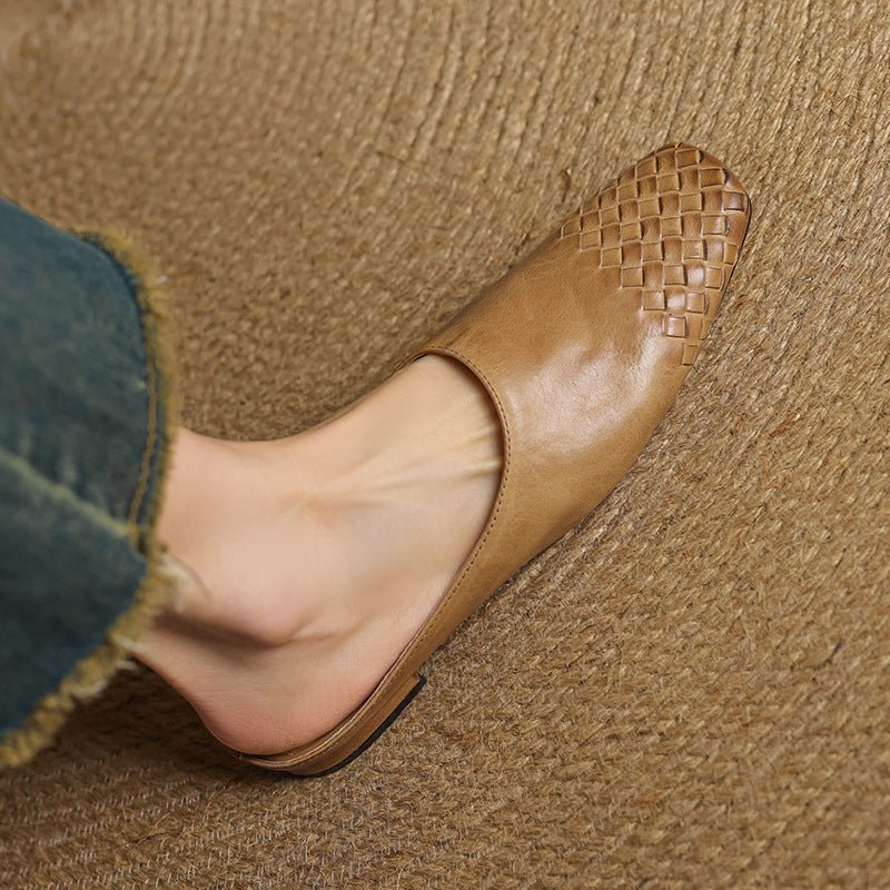 Women's chic slip-on mules with a stylish woven texture and modern square toe design.