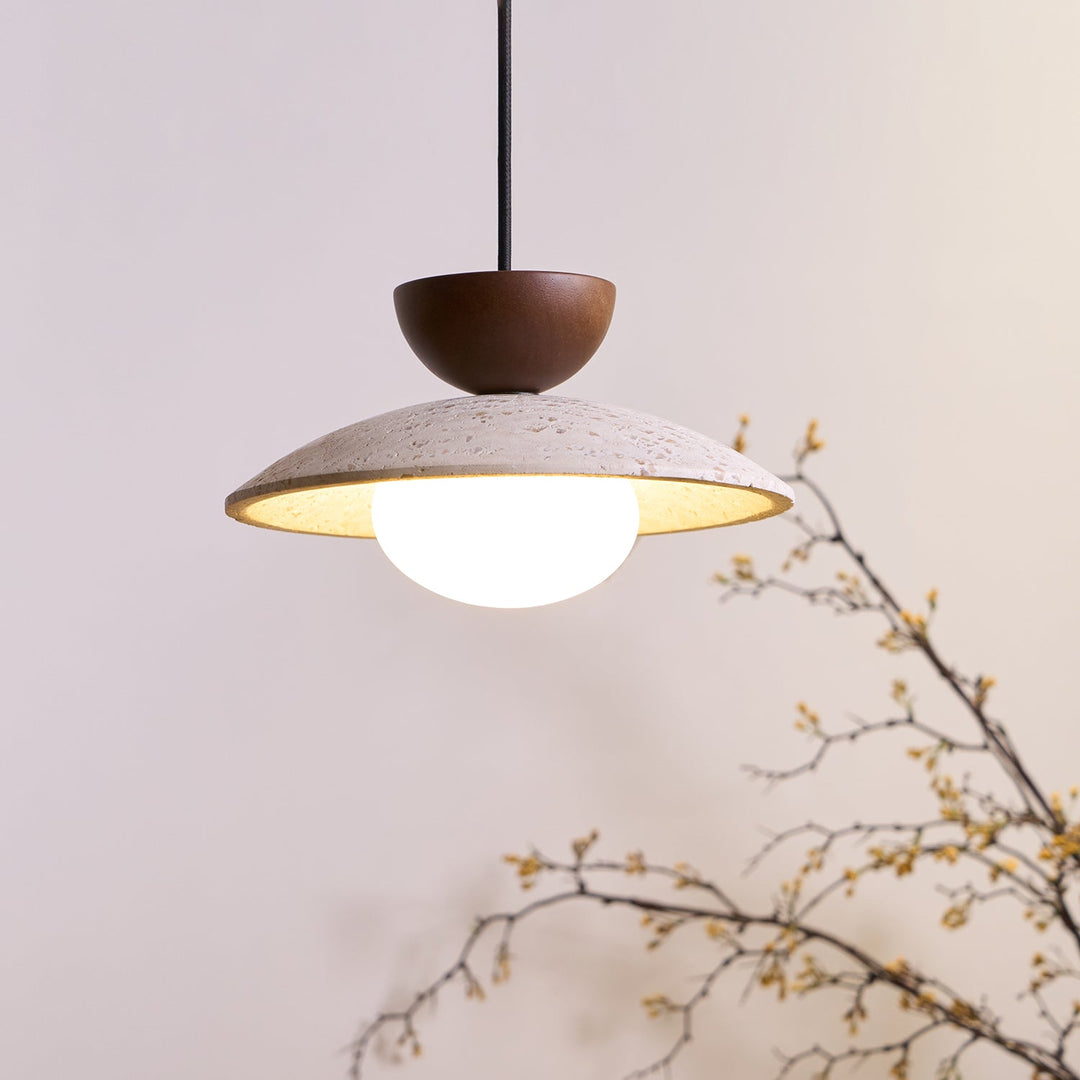 Side view of Elegant Yarelle pendant light. Travertine, wood, & glass. Modern lighting for living room.