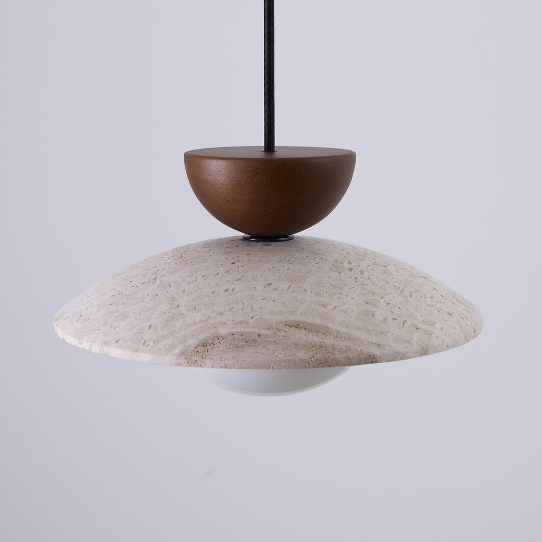 Bright Yarelle pendant light illuminating a modern space. Travertine, wood, & glass elements for style.