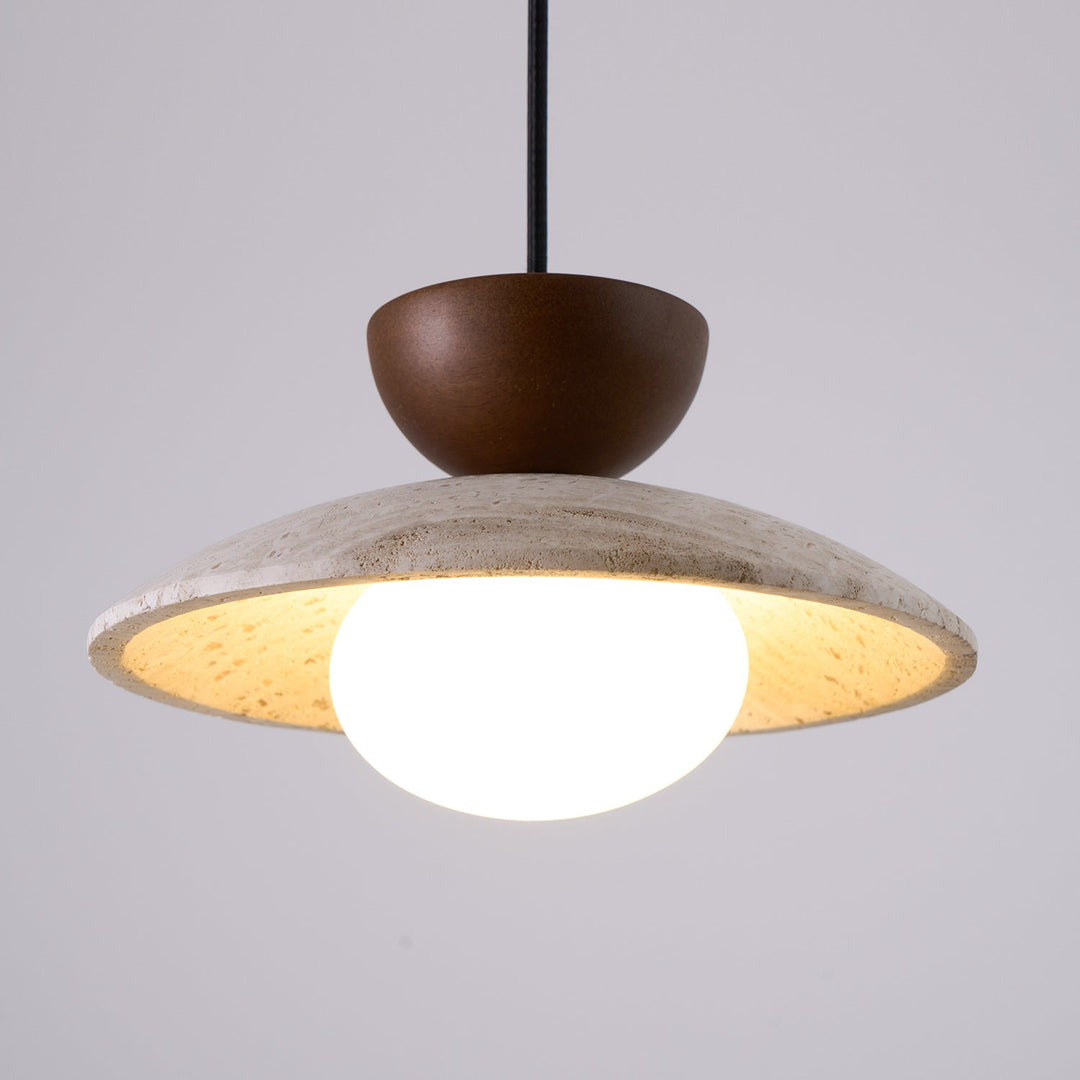 Artful Yarelle pendant light. A blend of travertine, wood, & glass creating a modern sculptural piece.