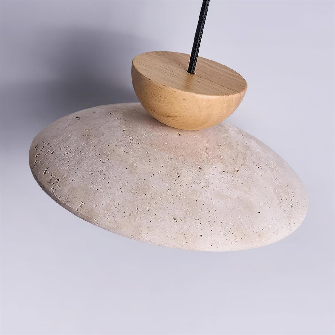 Yarelle pendant light suspended from ceiling. Modern fixture with travertine, wood, & glass for home.