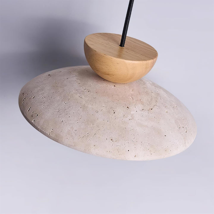 Yarelle pendant light suspended from ceiling. Modern fixture with travertine, wood, & glass for home.