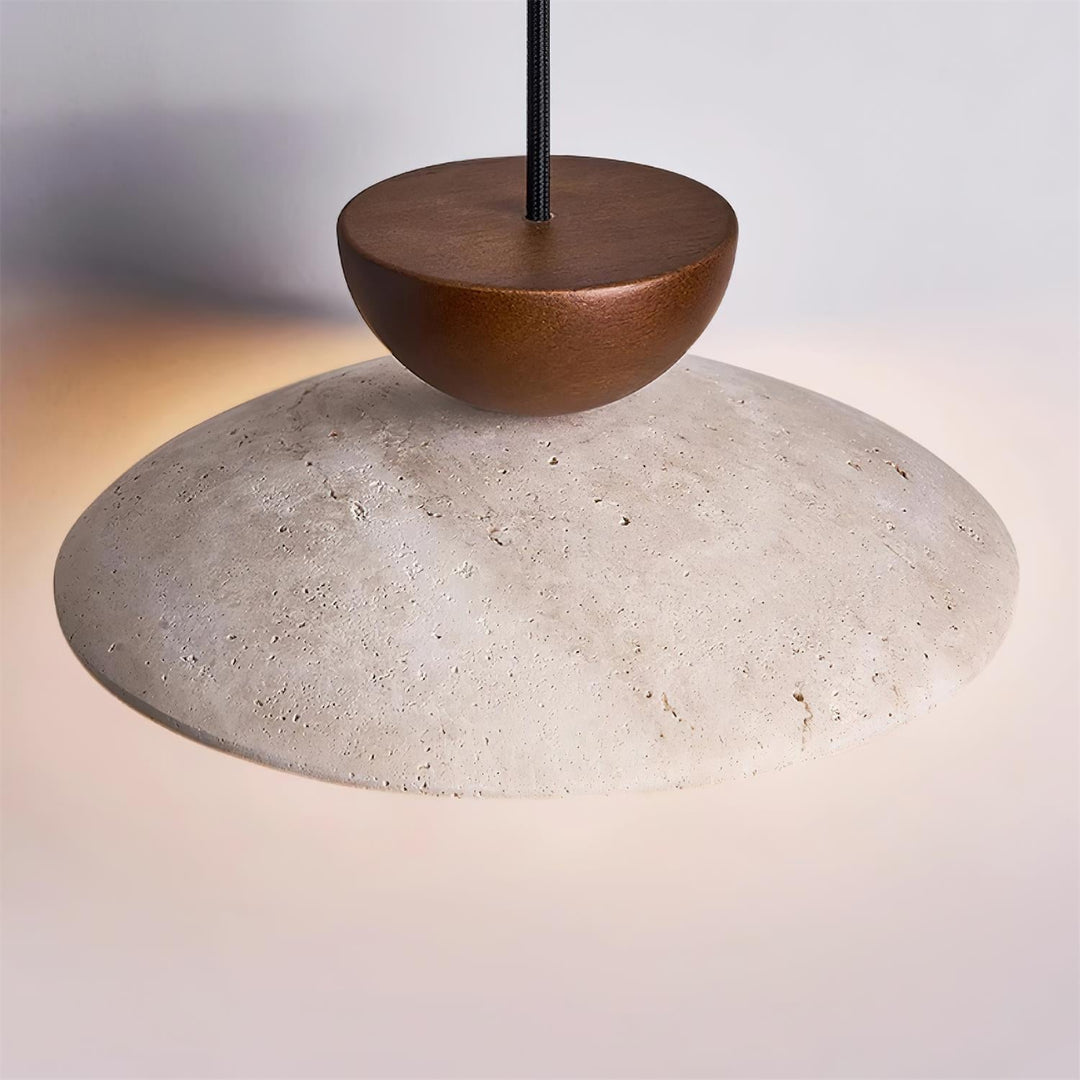 Elegant Yarelle pendant light creating a warm ambiance in a modern living room. Travertine, wood, glass design.