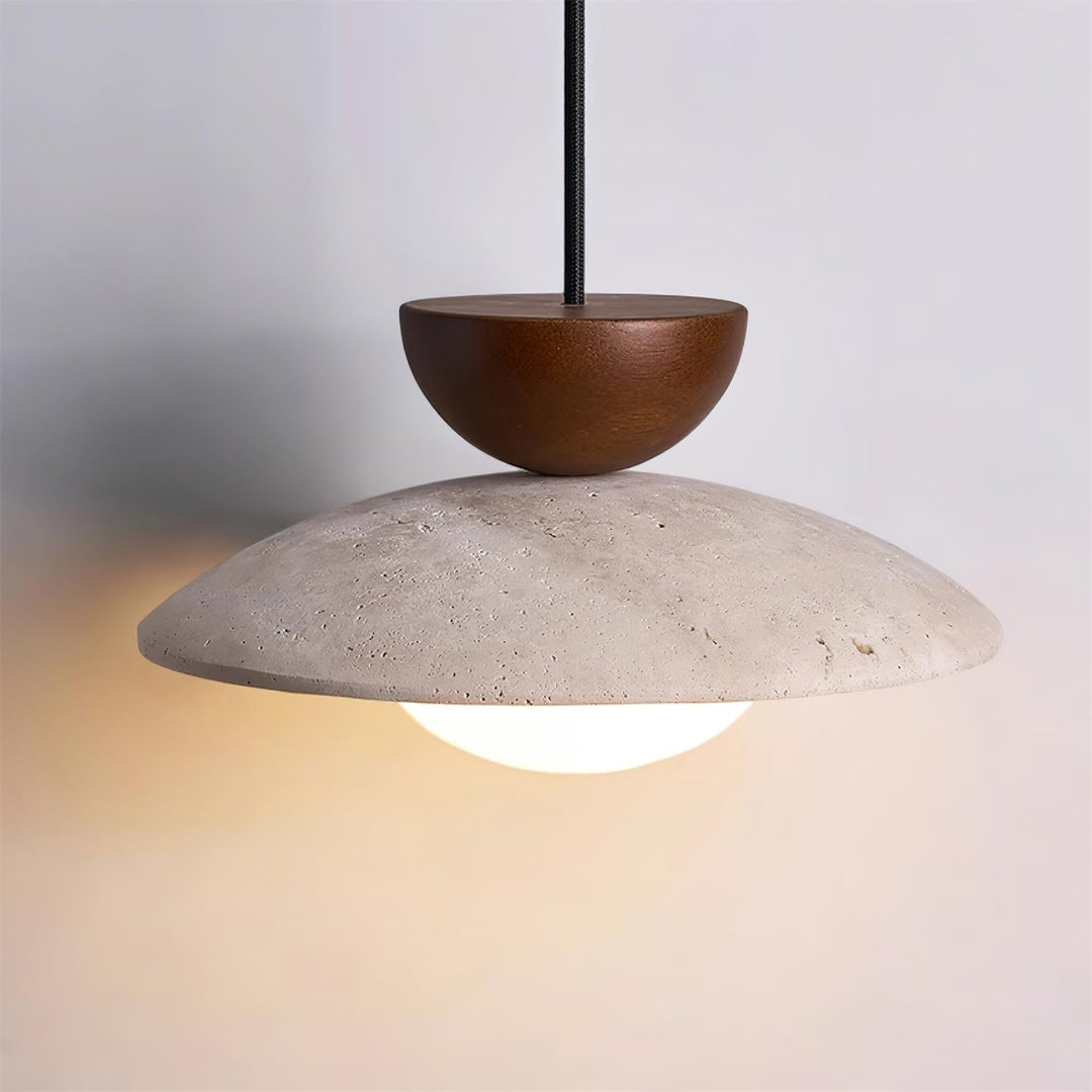 Unique Yarelle pendant light combining natural travertine, wood, & glass for a modern aesthetic. Home lighting.