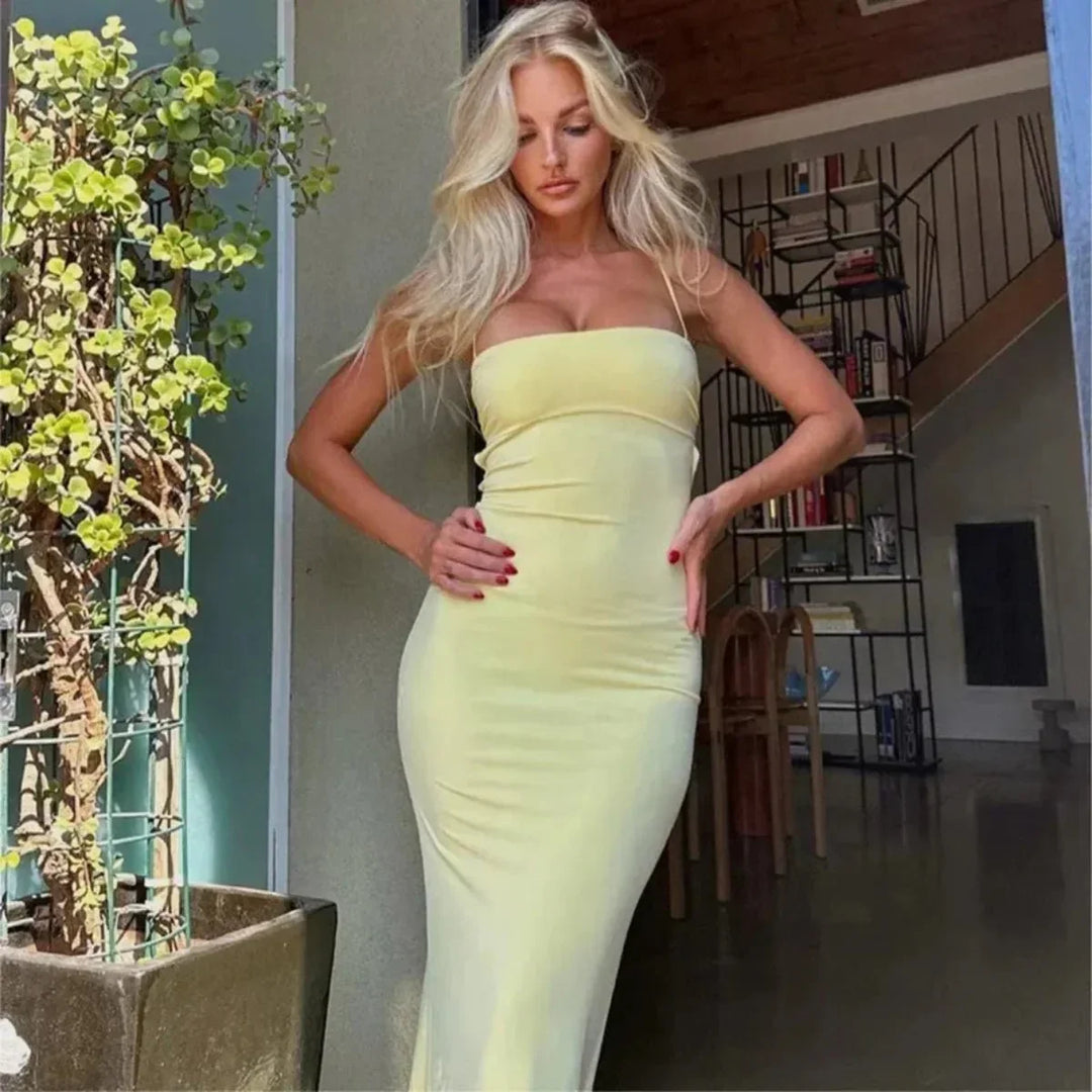 Stylish women's yellow backless bodycon maxi dress. Versatile long evening wear for parties & formal events.