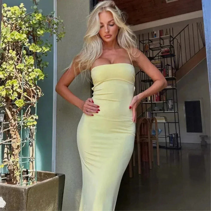 Stylish women's yellow backless bodycon maxi dress. Versatile long evening wear for parties & formal events.