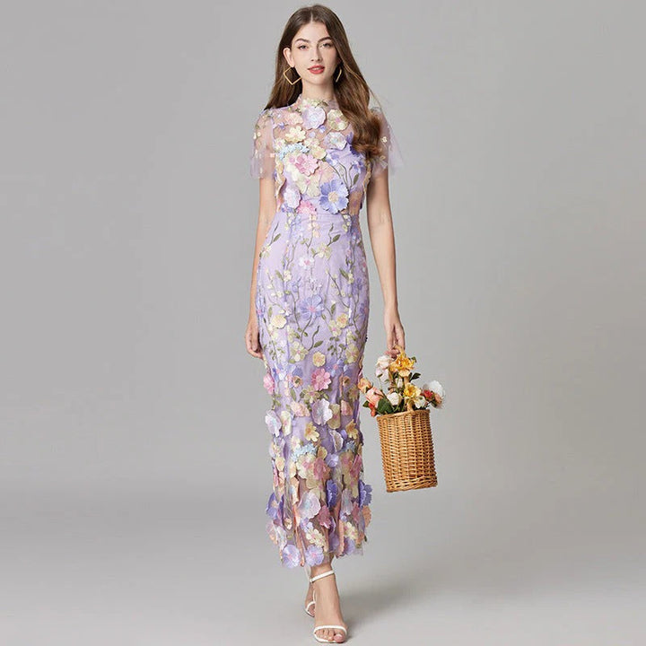 Beige embroidered mesh maxi dress for women. Sophisticated sleeveless evening gown for special occasions.