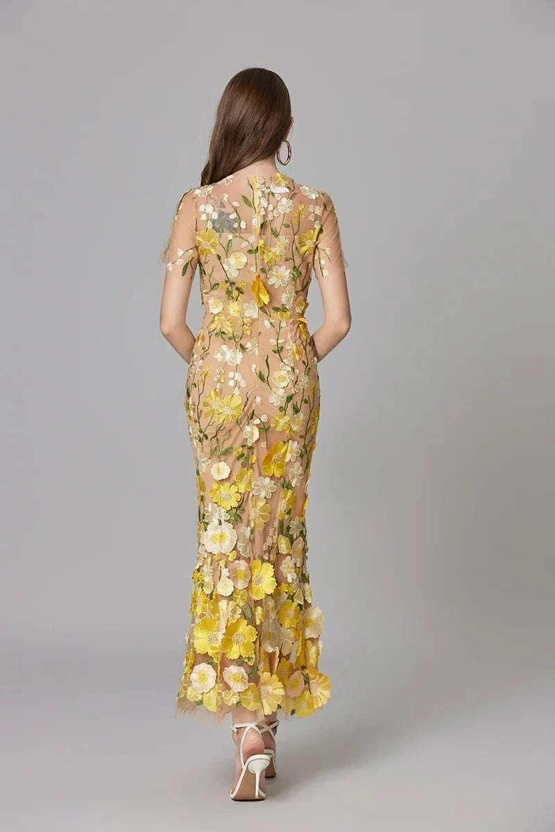 Stunning yellow mesh maxi dress for women, featuring exquisite embroidery. Elegant sleeveless design for events.