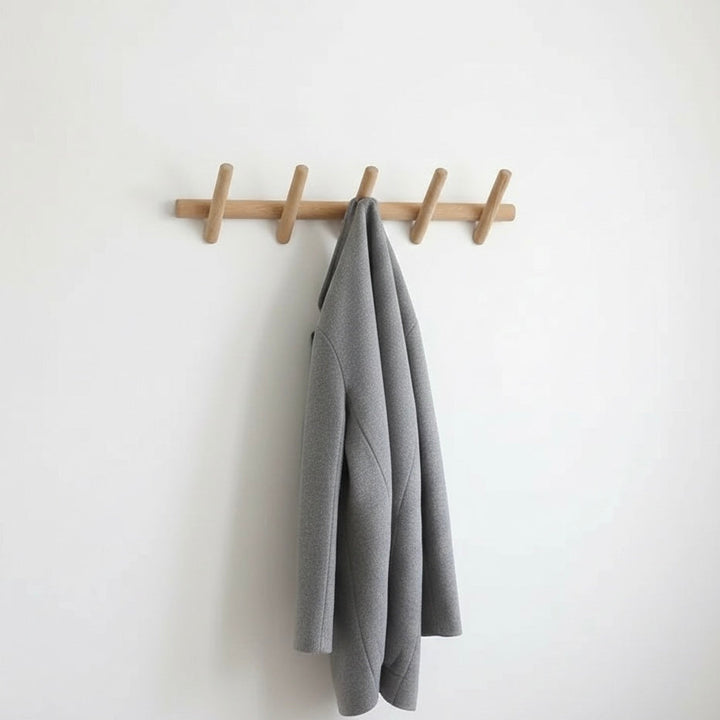 Entryway wall coat rack with 5 black hooks. Perfect modern home organization for coats, hats & keys.