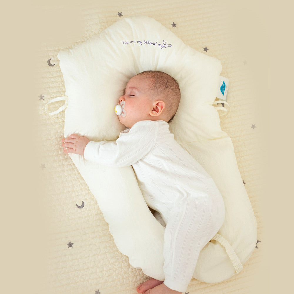 Ergonomic baby sleep cushion provides safe, antibacterial comfort and support for newborns. Ideal for restful infant sleep.