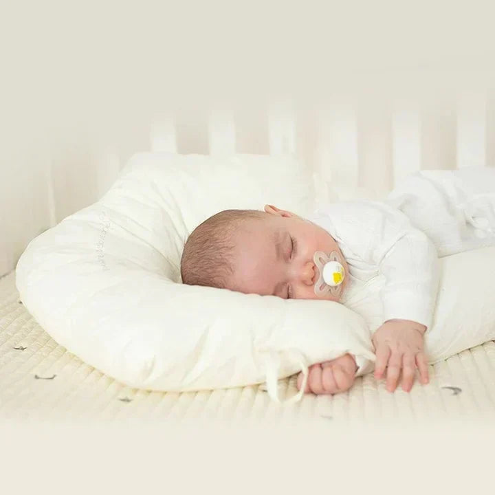 Soft, ergonomic baby sleep cushion offers gentle support for infant's head & back. Antibacterial for healthy sleep.