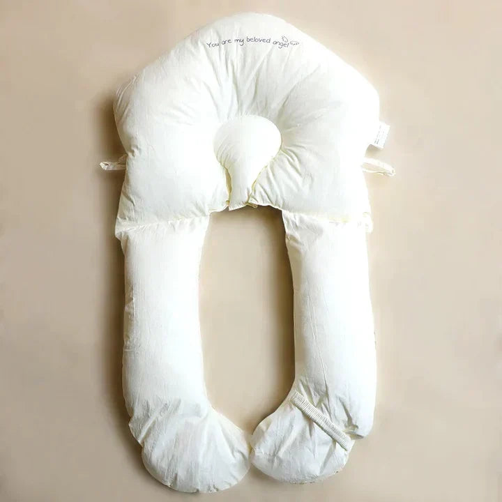 Antibacterial ergonomic baby sleep aid cushion provides gentle, contoured support for infants. Machine washable.