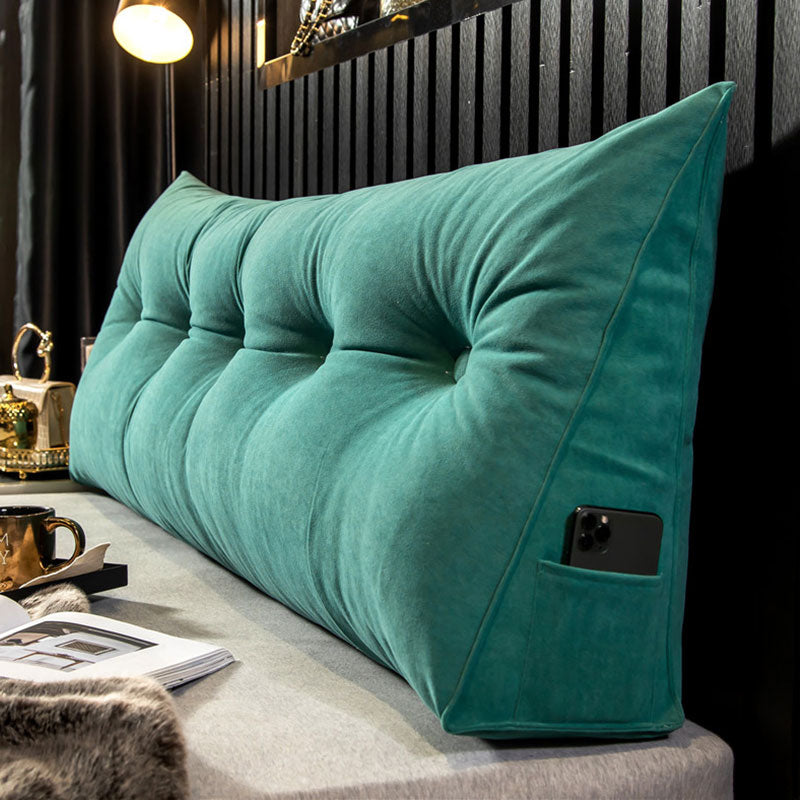 Ergonomic bed wedge pillow providing ultimate back support for comfortable lounging and relaxation.