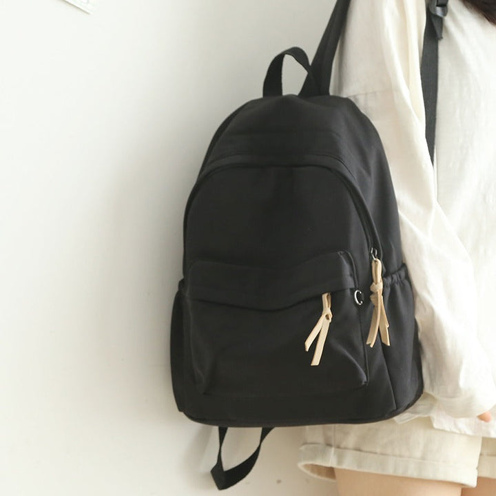 Spacious unisex travel backpack with ergonomic shoulder straps for comfort on long journeys.