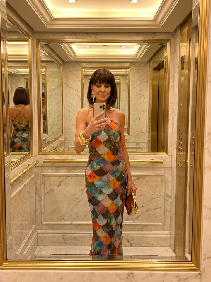Chic fitted women's halter maxi dress, an elegant evening or party dress with a distinctive geometric scale pattern.