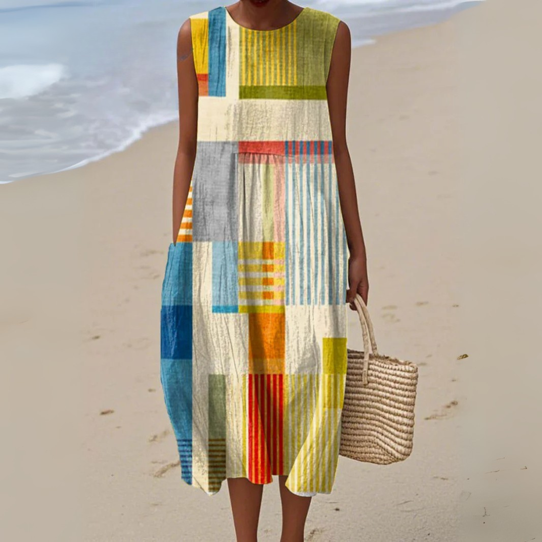 Flowing vibrant geometric colourblock sleeveless midi summer dress for women, ideal for casual wear.