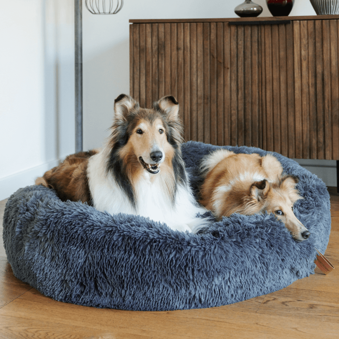 Round fluffy dog bed, perfect for deep sleep & anxiety relief. Soft faux fur donut pet bed.