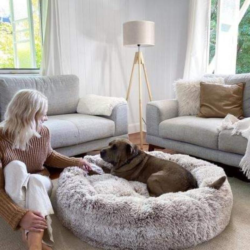 Luxury calming donut dog bed, fluffy faux fur, designed for anxiety relief & deep sleep. Pet supplies.