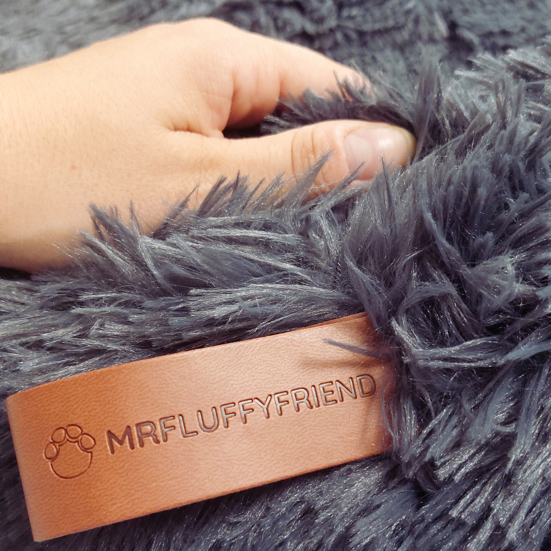 Deep sleep calming dog bed, fluffy donut shape, reduces anxiety. Ultra-soft faux fur pet supplies.