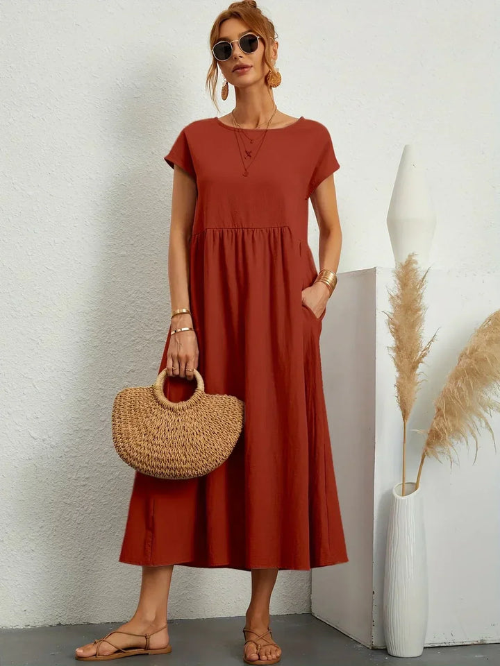 Relaxed fit women's midi dress, flowy & elegant, ideal for versatile everyday style.