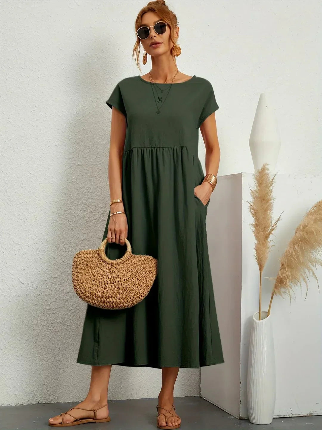 Timeless elegant women's midi dress, comfortable & fluid, great for casual or occasion wear.