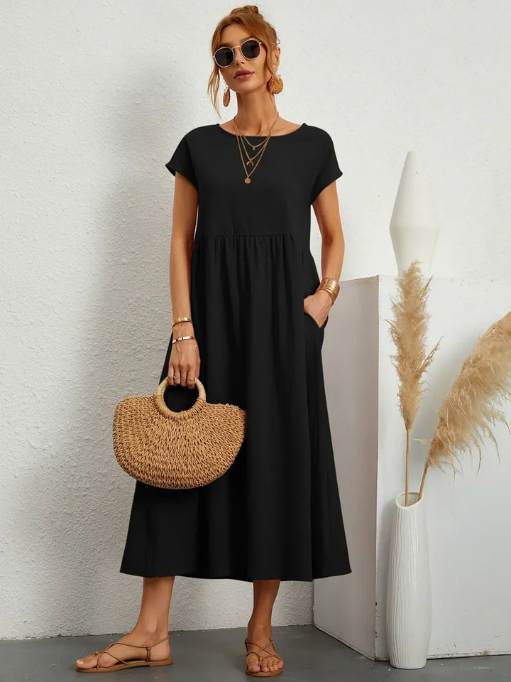 Flowy women's midi dress, relaxed fit, elegant & comfortable for versatile spring fashion.