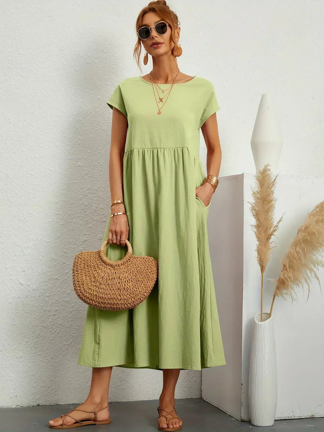 Elegant women's midi dress, timeless design, fluid fabric for comfortable everyday style.