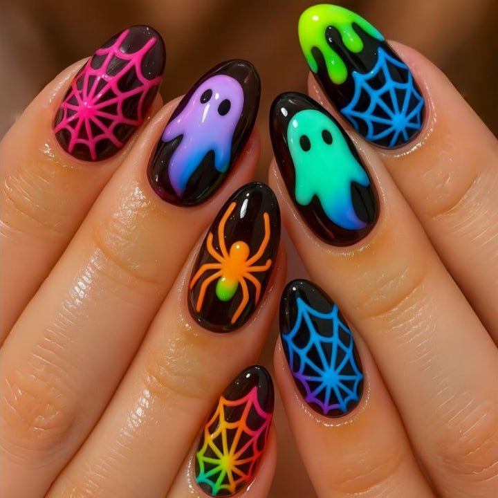 Fluorescent Halloween press-on nails for women, featuring spooky ghost & spider designs. Glow-in-the-dark costume nail art.