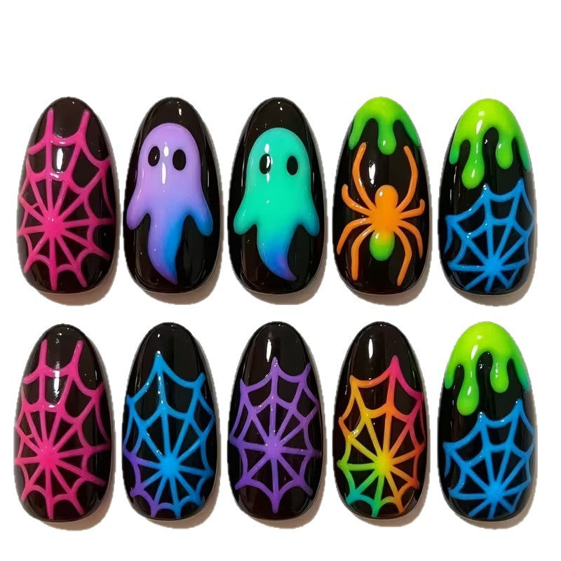 Halloween press-on nails set for women, featuring fluorescent spooky designs like ghosts and spiders, perfect for parties.