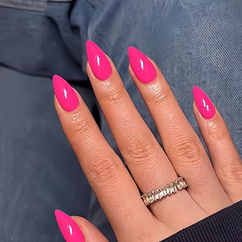 Vibrant fluorescent pink fake nails for women, easy application press-on manicure for quick beauty enhancement.