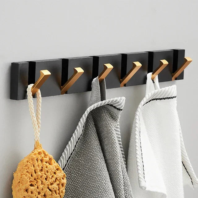 Elegant gold foldable wall hook for stylish home organization & space-saving solutions.