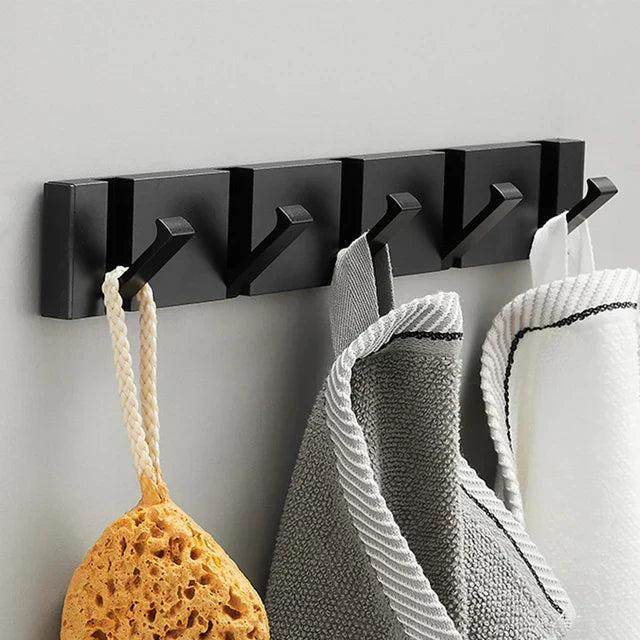 Compact foldable wall hook for tight spaces, perfect for organizing items in small homes.